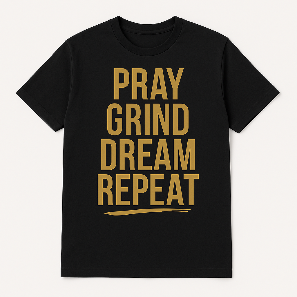 Black t-shirt with gold text 'PRAY GRIND DREAM REPEAT' on a white background