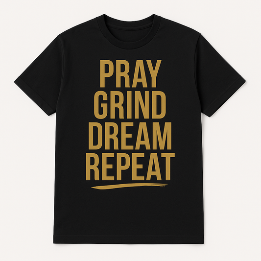 Black t-shirt with gold text 'PRAY GRIND DREAM REPEAT' on a white background